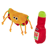 Mad Cat Taco Tuesday plush toys feature a taco with googly eyes and orange, green, and red string limbs, plus a hot sauce bottle in red with a green cap and text label—perfect for spicing up your playtime!.