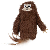 The Mad Cat Sloth Kicker Cat Toy resembles a sloth with brown fuzzy fur, a fluffy tail, and tan-marked white eyes with a small smile. Its light paws make it an ideal cozy companion, and its infused with catnip and silvervine for playful fun.