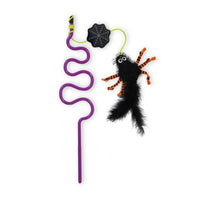 The Mad Cat Creepy Crawly Wand is a fun, purple swirled straw featuring a Halloween-themed design with a fuzzy black spider, orange striped legs, and a fluffy tail attached to a green loop with a black spiderweb. Ideal for interactive play, it captures the spooky spirit of the season.