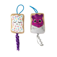 Quirky Kitty Flingin Purr Tarts feature two plush toy pastries with loops: the left, enhanced with North American-grown catnip, has sprinkles and a purple braided tail; the right shows a purple icing face, silver wrapper, and wavy tail. Adorable faces make them perfect playmates for your pet!.