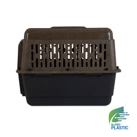 The Ruffmaxx Camo Kennel by Ruff Maxx features a dark base with a brown ventilated top and rectangular slots for 360-degree airflow. The EcoTEC Plastic logo on the bottom right emphasizes its recycled material construction.