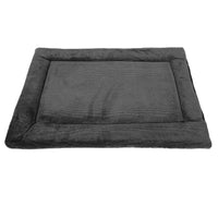 The Petmate Kennel Mat by Petmate is a soft, rectangular dark gray pet bed with a raised border and plush mattress surface for maximum comfort. Its non-skid bottom ensures it stays in place, making it ideal for any setting. The bed is photographed on a plain white background.