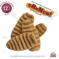 Ridged, oval Wild Eats Sweet Potato Treats are piled together. The 12 oz package reads "Real food with a satisfying crunch, Supports Digestive Health," and the low-calorie dog treats feature the Wild Eats logo.