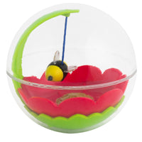 The Mad Cat Buzzy Ball Cat Toy features a clear sphere encasing a red and green flower-shaped base. A toy bee, attached with a blue string to a green hook, hovers above it. This engaging toy keeps cats active and their instincts sharp.