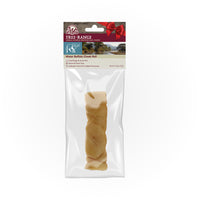 The Wild Eats Water Buffalo Cheek Roll is displayed in clear packaging with a red bow graphic. Labeled Free Range, it is sustainable, grain and gluten-free, and contains no added hormones, ensuring a quality chew for your pet.