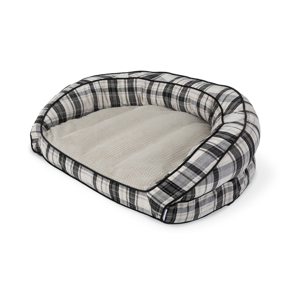 The La-Z-Boy Harper Sofa Plaid dog bed combines comfort and style with its plush, oval interior and cozy light beige cushion. Its black and white checkered sides add a fashionable touch, ensuring your pets resting space is both comfortable and stylish.