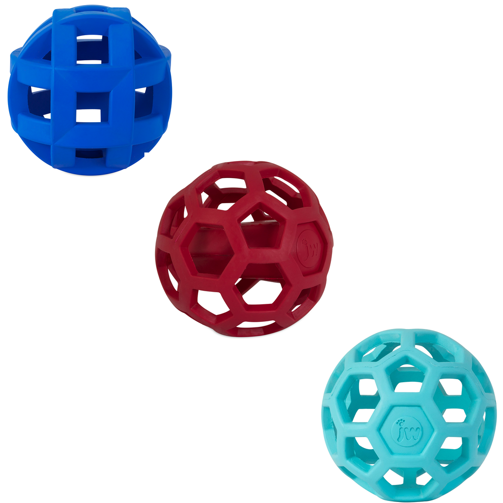 The JW Hol-ee Dog Toy Bundle Large from Jw features three geometric hollow balls made of natural rubber: a blue square-patterned ball, a red hexagonal mesh ball, and a light blue hexagonal mesh ball. Ideal as puzzle toys for dogs on any white background, they mirror the visual appeal of a Hol-ee Roller.