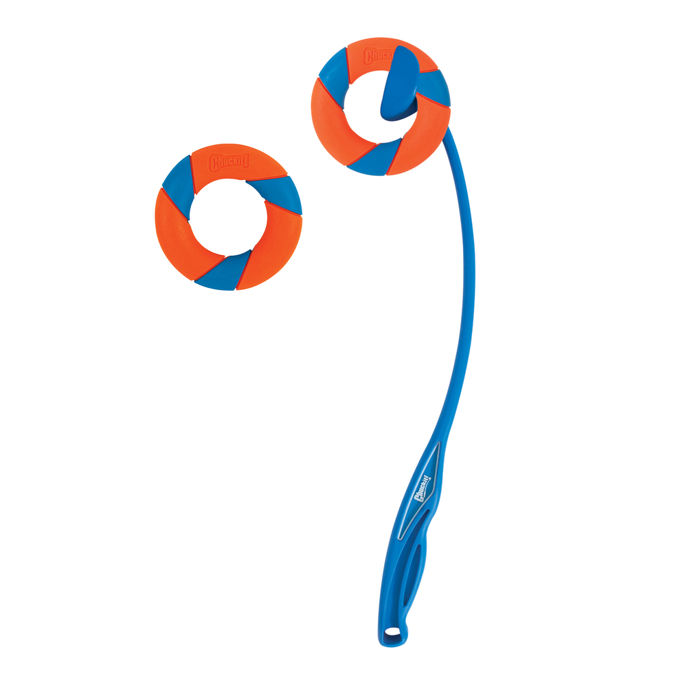 A Chuckit UltraRing Dog Fetch Toy & Launcher Bundle features a blue launcher with an ergonomic handle and two circular chewy UltraRing toys with vibrant orange and blue spiral patterns, all displayed on a white background.