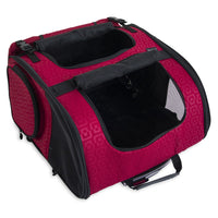 The Gen7Pets Red Geometric Roller-Carrier by Gen7 features a striking red hue with geometric patterns, mesh windows, and top and side openings for ventilation. It includes a handle and shoulder strap for easy transport and an interior lined with sleek black fabric.